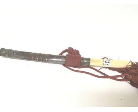 An Antique white metal mounted Tanto short sword the scabbard with applied white metal and attached tassel. Length 47cm.