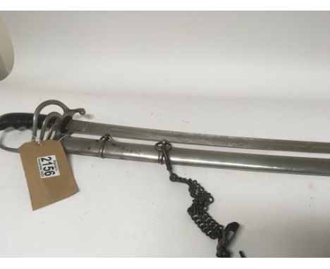 An interesting light weight sword with an engraved blade and metal scabbard. Total length 94cm