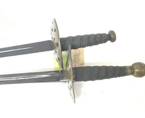 Two conforming late 19th century swords with round brass guards wired grips and straight tapering steel blade no scabbard len