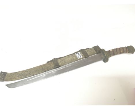 A Chinese sword the scabbard and grip with applied shagreen and with patterned brass mounts length 66cm.