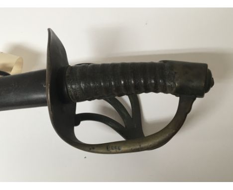 A 19th century French 1822 pattern cavalry sword with a half brass open basket hilt the steel blade with impress marks. metal