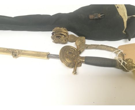 An elaborate gilt metal Victorian officers dress sword with a crown pommel wired grip engraved blade and leather and gilt met