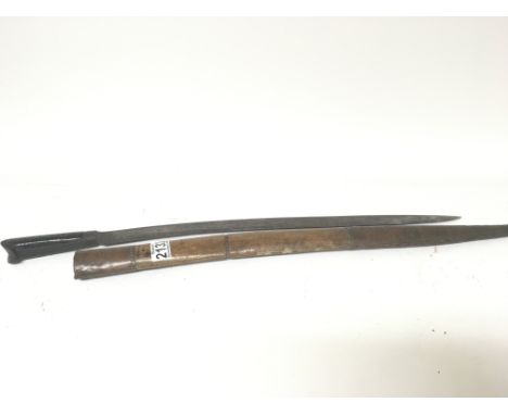 A 19th Century Yatagan Ottoman sword with studded horn handle steel blade the wooded scabbard with copper ends. Length 70cm