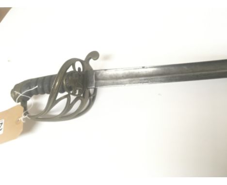 A Victorian military sword with a brass Guard with open scroll and a Victorian cypher steel blade no scabbard. Length 96cm