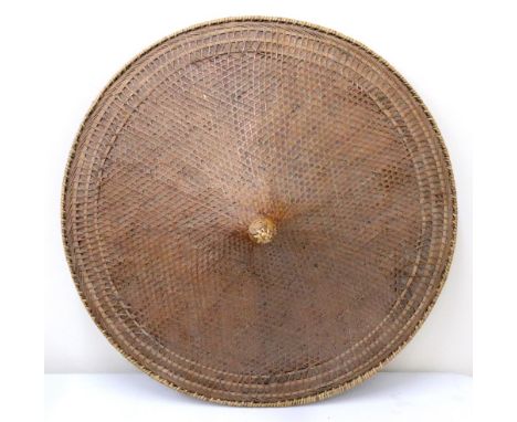 A large basketwork coolie type hat, probably Japanese, 62cm diameter, a Philippines bamboo three-tier stand, 38cm wide, a bam