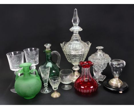 A group of glassware, late 19th/20th century, including: a ruby stained carafe, a cut glass urn and cover, a pair of engraved