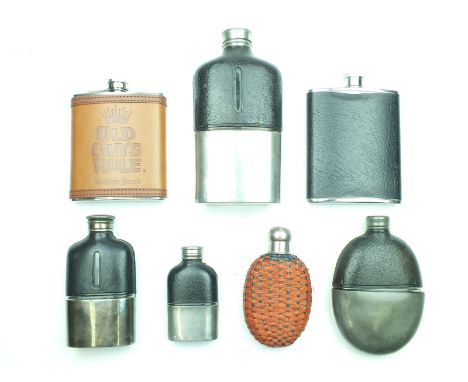 Seven various hip flasks, two modern, the remainder vintage pewter with leather covered glass bodies and one rafia covered gl