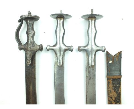 A late 18th Century (?) Tulwar, 63cm curved double fullered blade, cast hilt decorated with foliage, pierced and channelled g