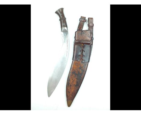 An Indian Military issue Kukri, 34cm sharply curved blade with single fuller, stamped with Indian Government issue marks and 