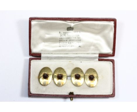 A pair of heavy 18ct gold and cabochon ruby cufflinks