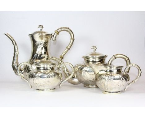 A heavy Chinese hallmarked silver four piece tea set with embossed decoration of bamboo. Coffee pot h. 22 cm. Weight overall 