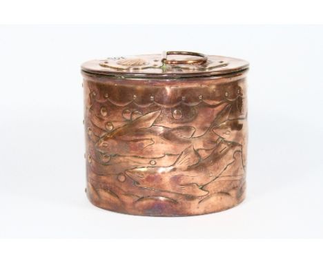 A Newlyn hammered copper tea caddy decorated with sharks. H. 13 cm, w. 15 cm.