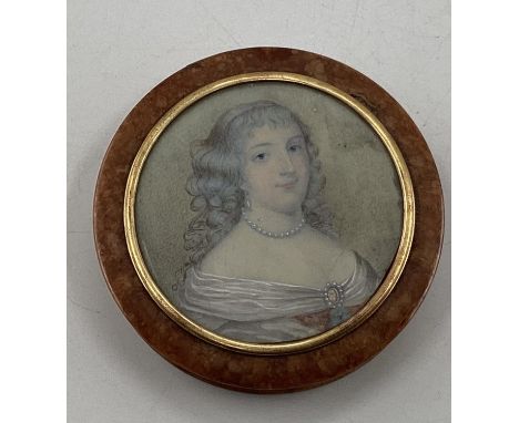 A circular walnut table snuff box, the cover set with a portrait of an C18th lady with yellow metal mount, with black lacquer