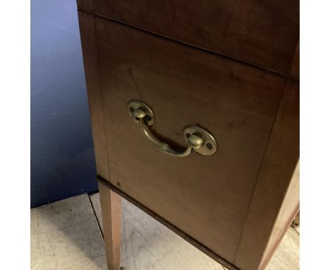 A good m mahogany wine cooler, with four tapered legs to castors, inside fitted metal wine compartments 