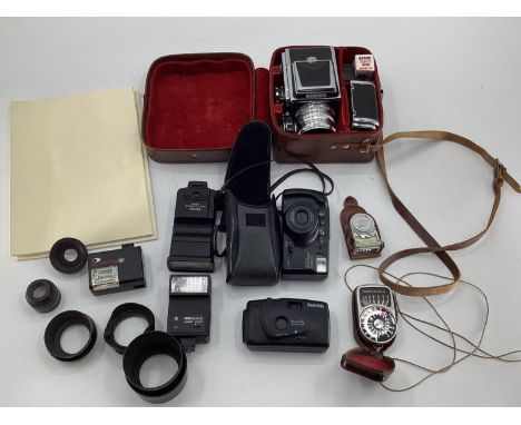 A Zenith 80 Cine Camera and accessorised in a lined leather carry case, together with other photographic equipment and camera