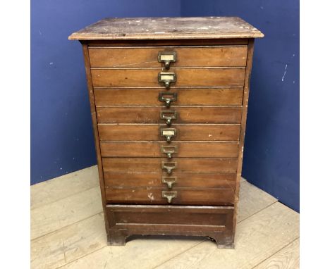 A Vintage narrow filing chest of 9 drawers, bearing label to bottom section: Percy Jones Ltd, 69cmW x 58cmD 100cmH 