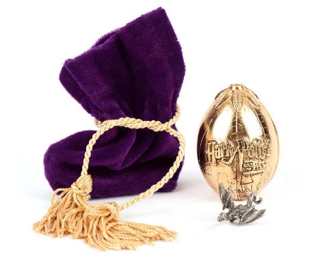 Harry Potter and the Goblet of Fire (2005) a golden Triwizard tournament egg with pewter Chinese Fireball dragon, promotional