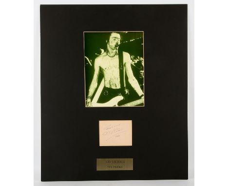 Sid Vicious Sex Pistols Autograph display  Signed by Sid Vicious in blue ink on an inset autograph album page, Thanks - Sid V