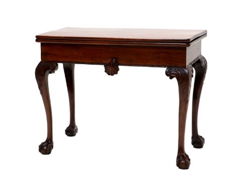 A George III Carved Mahogany Foldover Card Table, late 18th century, the pivoting leaf enclosing a green baize-lined interior