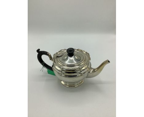 Geo.V silver teapot, ebony handle and finial on circular stepped foot, Birmingham 1924, H13cm. 