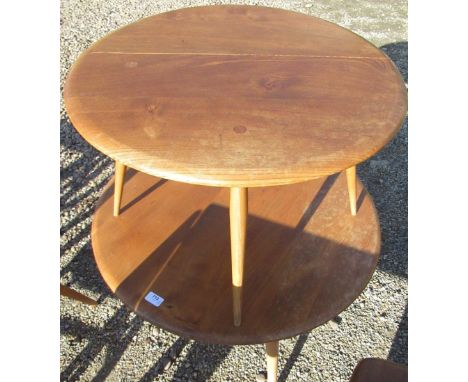 Ercol light elm coffee table, circular top on three turned outsplayed supports D75cm H43cm, and similar single drop leaf coff