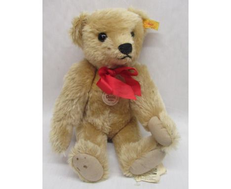 Steiff 1909 classic teddy bear blonde mohair fur with jointed limbs bearing original labels H32cm 