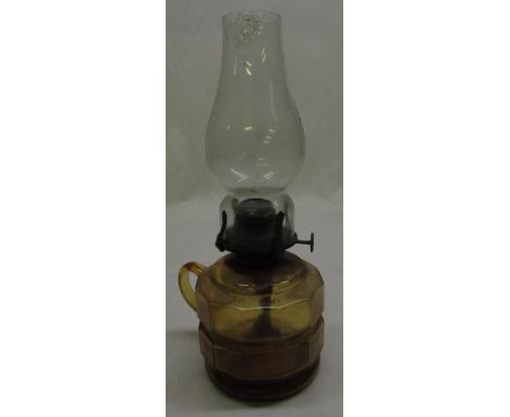 C20th gilt bed paraffin lamp with amber glass bowl and clear glass chimney H29cm 