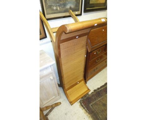 An Eastern hardwood bench, the seat curving up to form the arm rails, with bamboo seat and sides