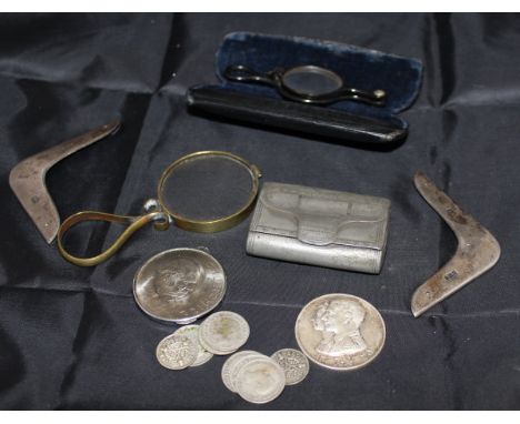 A plated snuff box in the form of a wallet, containing various threepences and sixpences, a brass mounted magnifying glass, a