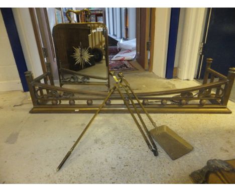 A Victorian brass fender in the Art Nouveau style, together with a small brass framed mirrored fire screen and a collection o