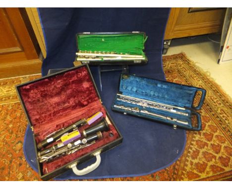 A Yamaha YFL 21S plated flute, a Parrot flute and a Boosey & Hawkes Emperor clarinet
