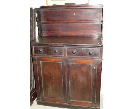 A 19th Century mahogany chiffonier with raised two shelf back over two drawers and two cupboard doors