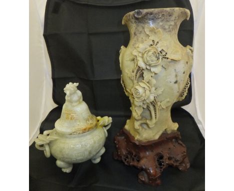 An Oriental carved jade / hardstone censer and cover with dragon finial and dragon handles with rings, raised on three paw fe