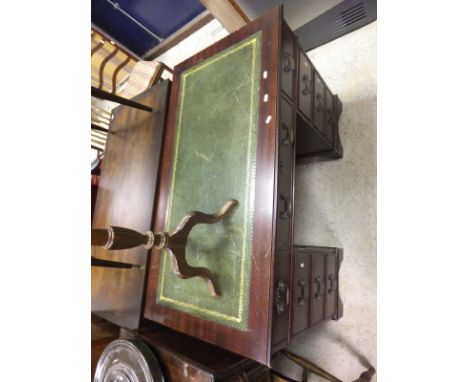 A mahogany pedestal desk with green leather inset top, a reproduction mahogany shallow bow fronted sideboard in the Regency t