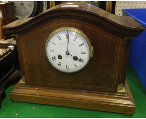 An early 20th Century mahogany and inlaid cased eight day mantel clock, the dial with Roman numerals inscribed "Walker & Hall