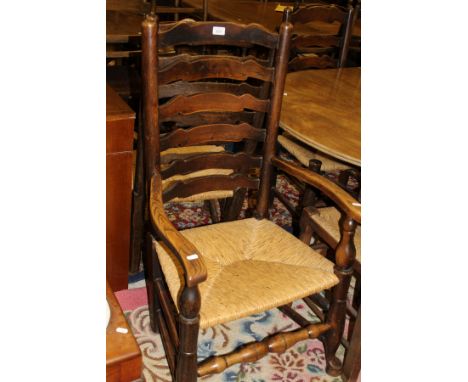 A 19th Century harlequin set of six rush seat ladder back chairs, together with a set of four similar
