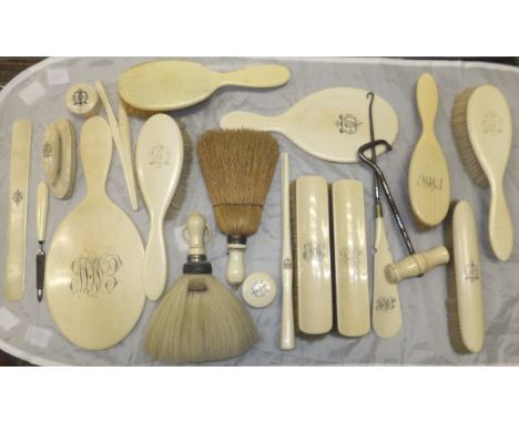 A collection of various Victorian ivory and bone-handled dressing table wares, boot pulls, glove stretchers, brushes, etc, a 