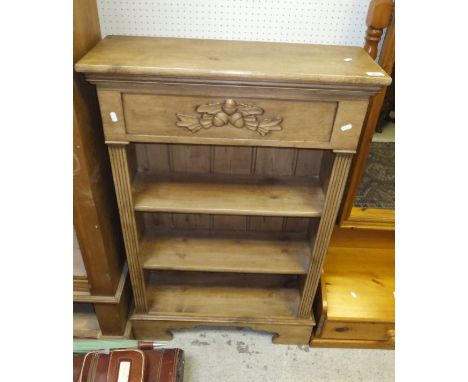 A pine open three shelf bookcase, raised on bracket feet