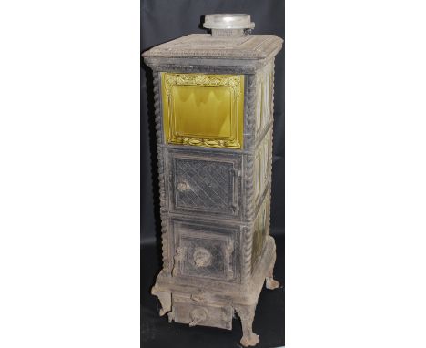 A Continental cast iron and ceramic tiled greenhouse type heater in the Victorian taste