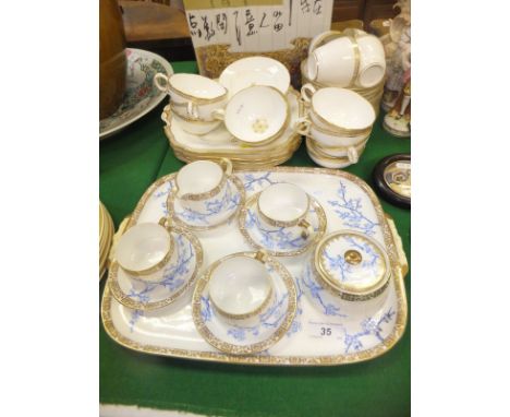 A Victorian cabaret set by Edwin James Drew Bodley comprising three cups and saucers, jug, saucer, sugar bowl and cover and t