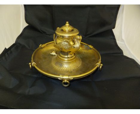 A 19th Century French gilt brass inkwell in the Empire taste, the well with twin stork decoration