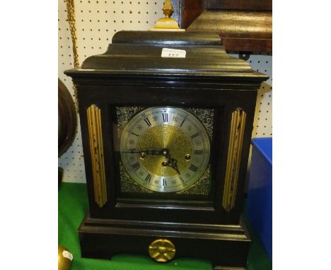 A 20th Century ebonised and gilt cased German eight day mantel clock