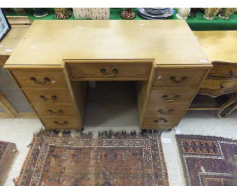 A pitch pine breakfront double pedestal desk