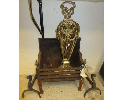 A 20th Century brass peacock fire screen, pair of wrought iron fire dogs and a cast iron fire basket with integral back
