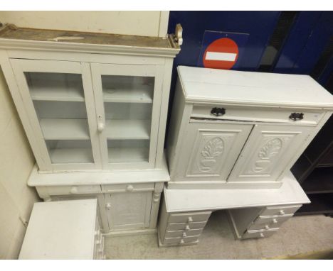 A Victorian white painted bookcase cabinet, a Victorian white painted chiffonier, each with carved panelled decoration, toget