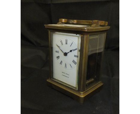 A 20th Century lacquered brass cased carriage clock, the dial inscribed "Henry Wells of Shrewsbury"