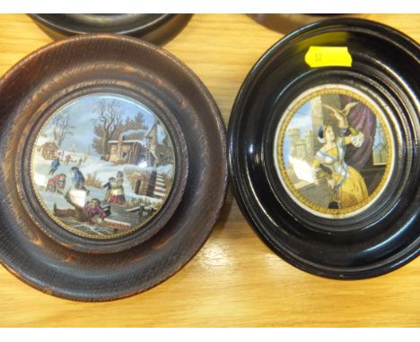 A collection of eight Pratt ware pot lids housed in circular wooden frames, to include "Red Riding Hood", "Alas Poor Bruin", 