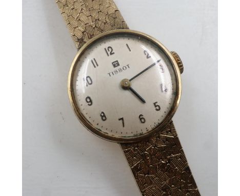 TISSOT: ladies 9ct gold cased manual wind wristwatch on a 9ct gold articulated bracelet, working at lotting, 23.1g. UK P&amp;