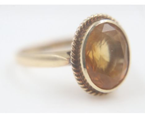 14ct gold solitaire ring set with a large faceted citrine, size K/L, 3.3g. UK P&amp;P Group 0 (£6+VAT for the first lot and £