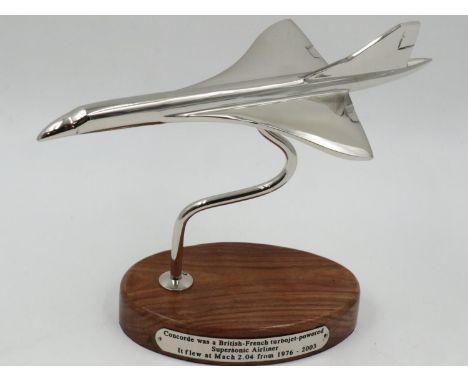 Chrome Concorde on wooden base. UK P&amp;P Group 2 (£20+VAT for the first lot and £4+VAT for subsequent lots) 